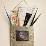 Madonna pocket with pencil, paper and brushes - photo transfer, appliquéd fabrics with wooden rod and yarn.